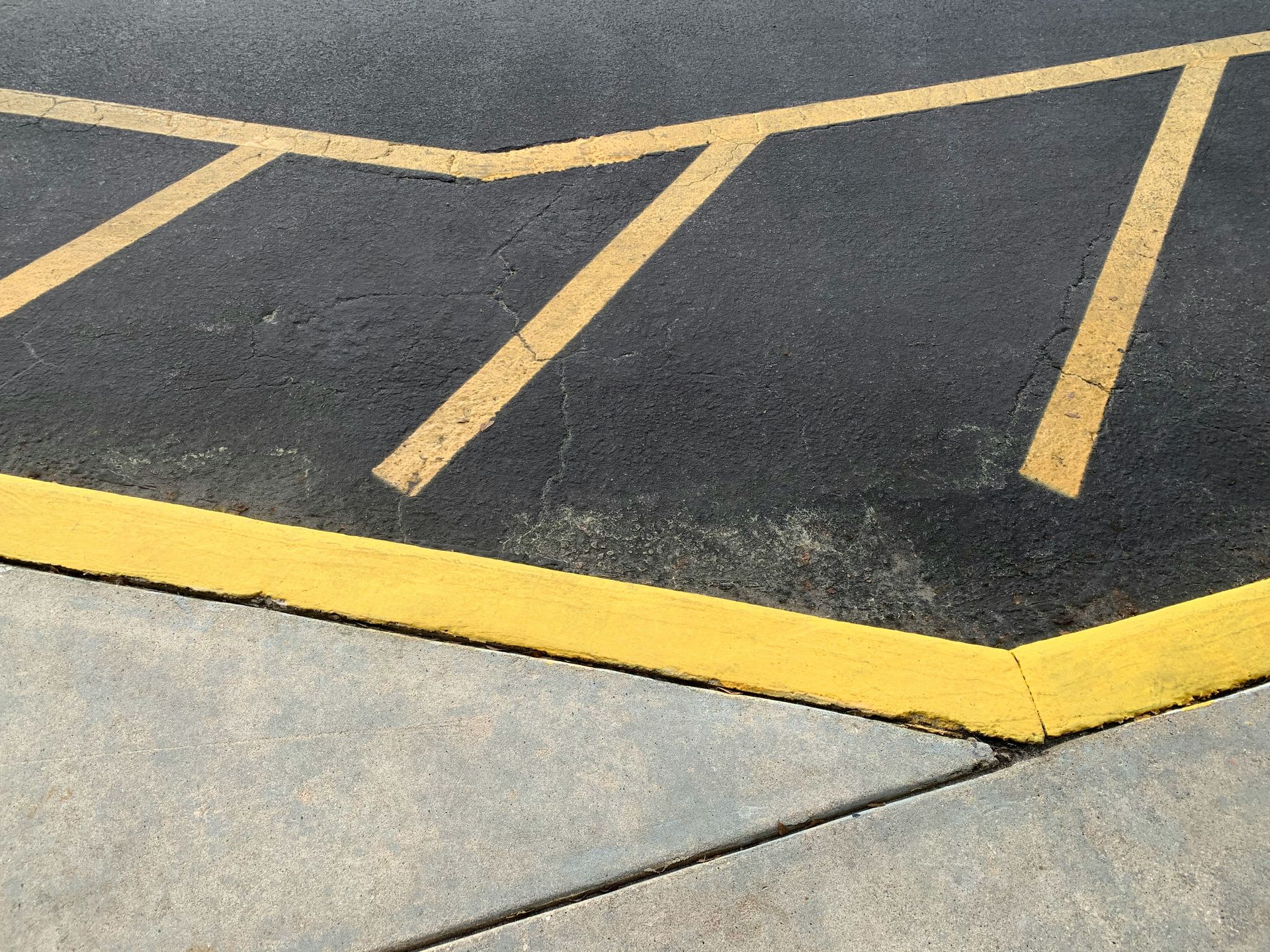 a parking lot with yellow lines painted on it